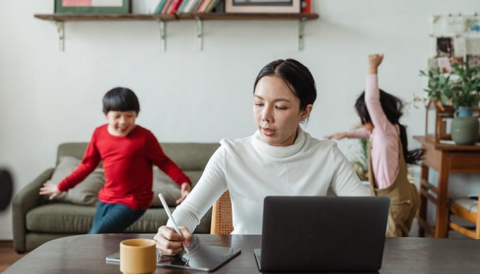busy-mom-working-on-laptop-and-noisy-children-running-around-4474042 busy-mom-working-on-laptop-and-noisy-children-running-around-4474042